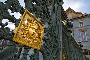 Gates of the Royal Palace of Turin (Palazzo Reale) embossed with a golden Medusa symbol, Turin, Piedmont, Italy, Europe