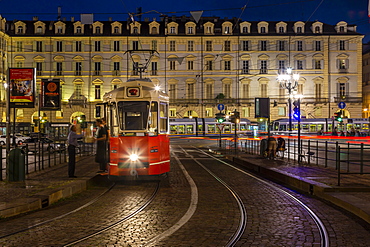 View of tram in Piazza Castello at dusk, Turin, Piedmont, Italy, Europe