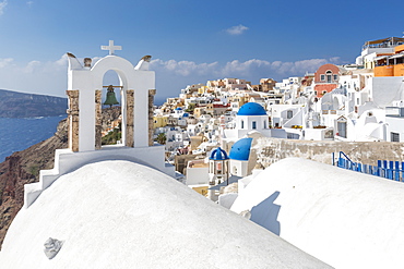 View of blue domed churches and Oia village, Santorini, Aegean Island, Cyclades, Aegean Islands, Greek Islands, Greece, Europe