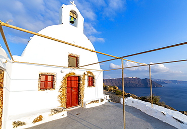 View of white washed hilltop church in Oia village, Santorini, Cyclades, Aegean Islands, Greek Islands, Greece, Europe