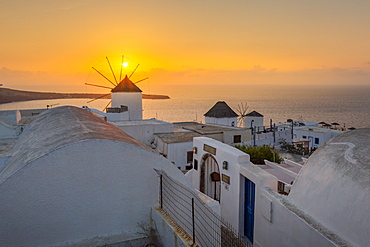 View of windmills at sunset in Oia village, Santorini, Cyclades, Aegean Islands, Greek Islands, Greece, Europe