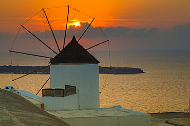 View of windmill at sunset in Oia village, Santorini, Cyclades, Aegean Islands, Greek Islands, Greece, Europe