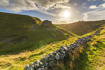 Stone wall through field in Peak District National Park, England, Europe