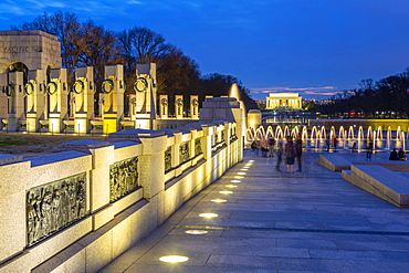 View of the World War Two Memorial and Lincoln Memorial illuminated at dusk, Washington, D.C., United States of America, North America