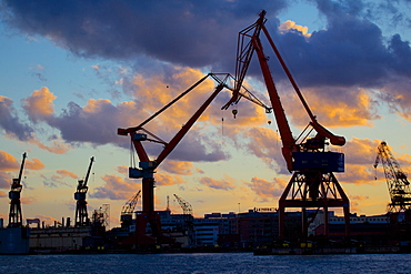 Dockyard cranes at sunset, Gothenburg, Sweden, Scandinavia, Europe