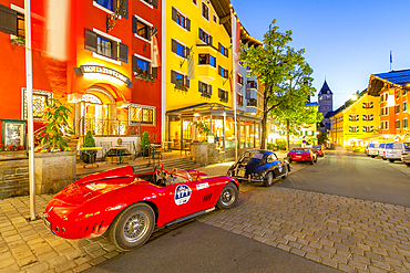 View of architecture and classic car on Vorderstadt at dusk, Kitzbuhel, Austrian Tyrol Region, Austria, Europe