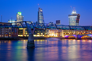 River Thames, Millennium Bridge and City of London skyline at dusk, London, England, United Kingdom, Europe 