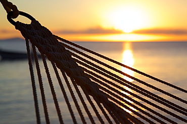 Hammock and beach at sunset, Morris Bay, St. Mary, Antigua, Leeward Islands, West Indies, Caribbean, Central America 