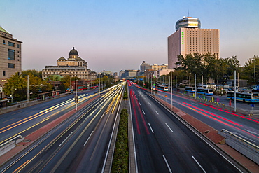 Traffic trail lights on major road near Beijing Zoo at dusk, Beijing, People's Republic of China, Asia