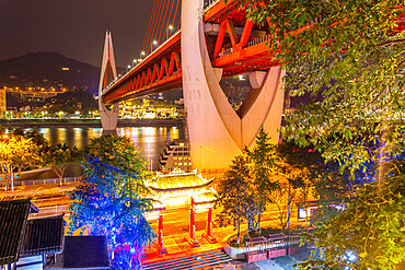 View of Masangxi Bridge and buildings near Arhat Buddhist Temple at dusk, Yuzhong District, Chongqing, China, Asia