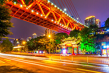 View of Masangxi Bridge and buildings near Arhat Buddhist Temple at dusk, Yuzhong District, Chongqing, China, Asia