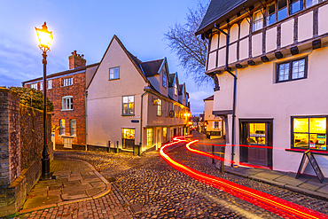 View of Elm Hill cobbled street and architecture at dusk, Norwich, Norfolk, England, United Kingdom, Europe