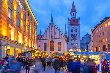 View of Old Town Hall and bustling Christmas Market in Marienplatz at dusk, Munich, Bavaria, Germany, Europe