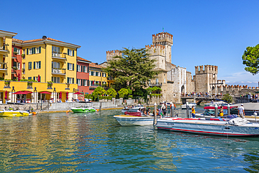 View of boats and Castello di Sirmione on a sunny day, Sirmione, Lake Garda, Brescia, Lombardy, Italian Lakes, Italy, Europe