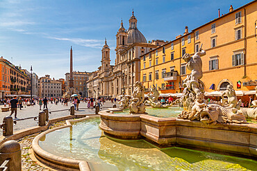 View of the Neptune Fountain and colourful architecture in Piazza Navona, Piazza Navona, UNESCO World Heritage Site, Rome, Lazio, Italy, Europe