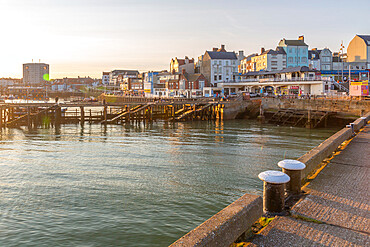 View of harbourside shops in Bridlington Harbour at sunset, Bridlington, East Yorkshire, England, United Kingdom, Europe