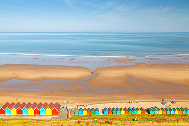 View of colourful beach huts on West Cliff Beach, Whitby, North Yorkshire, England, United Kingdom, Europe