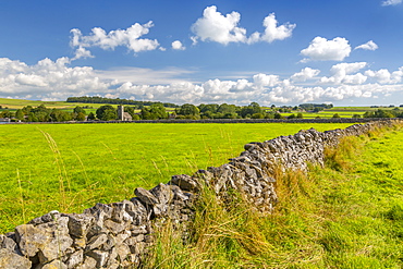 View of village church and dry stone walls, Biggin, Peak District National Park, Derbyshire, England, United Kingdom, Europe