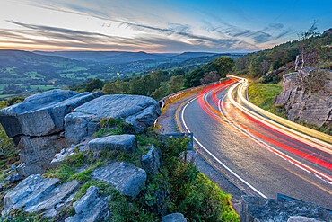 View of car trail lights from Surprise View at dusk, Millstone Edge, Derbyshire Peak District, Derbyshire, England, United Kingdom, Europe