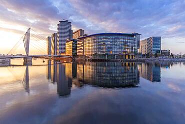 View of pedestrian bridge and MediaCity UK, Salford Quays, Manchester, England, United Kingdom, Europe