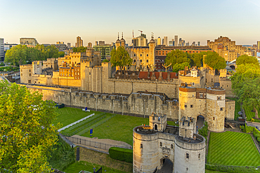 View of the Tower of London, UNESCO World Heritage Site, from Cheval Three Quays at sunset, London, England, United Kingdom, Europe