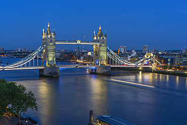 View of Tower Bridge and River Thames from Cheval Three Quays at dusk, London, England, United Kingdom, Europe