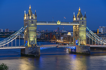 View of Tower Bridge from Cheval Three Quays at dusk, London, England, United Kingdom, Europe