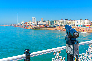 View of beach and telescope on a sunny day from Brighton Palace Pier, Brighton, East Sussex, England, United Kingdom, Europe