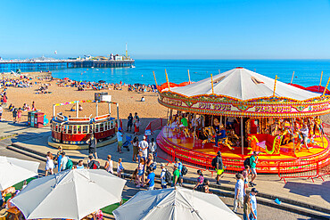 View of sea front carousel and Brighton Palace Pier, Brighton, East Sussex, England, United Kingdom, Europe