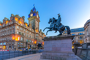 View of The Balmoral Hotel and statue of Arthur Wellesley (1st Duke of Wellington) at dusk, Edinburgh, Scotland, United Kingdom, Europe