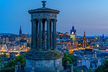 View of Edinburgh Castle, Balmoral Hotel and Dugald Stewart monument from Calton Hill at dusk, UNESCO World Heritage Site, Edinburgh, Lothian, Scotland, United Kingdom, Europe