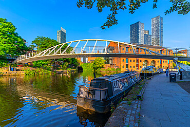 View of 301 Deansgate and footbridge (pedestrian bridge) (Merchants Bridge) over canal, Castlefield, Manchester, England, United Kingdom, Europe