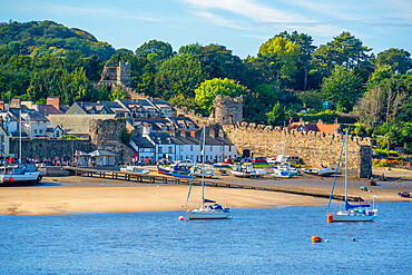 View of boats of the Conwy River and town wall, Conwy, Gwynedd, North Wales, United Kingdom, Europe