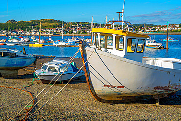 View of boats on the beach with Conwy River visible in background, Conwy, Gwynedd, North Wales, United Kingdom, Europe