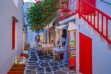 View of cafe in colourful narrow cobbled street, Mykonos Town, Mykonos, Cyclades Islands, Greek Islands, Aegean Sea, Greece, Europe