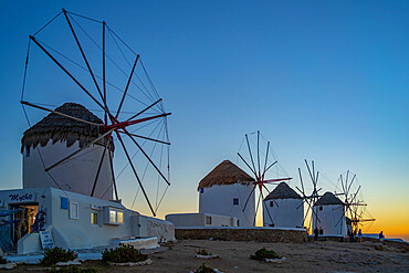 View of windmills at sunset, Mykonos Town, Mykonos, Cyclades Islands, Greek Islands, Aegean Sea, Greece, Europe