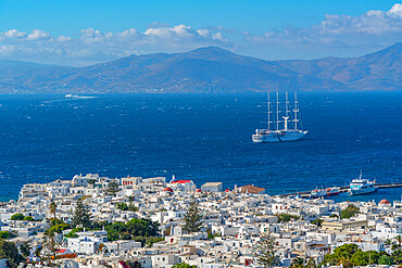 View of town and tall ship, Mykonos Town, Mykonos, Cyclades Islands, Greek Islands, Aegean Sea, Greece, Europe