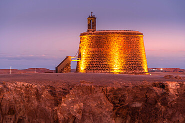 View of Castillo del Aguila o de las Coloradas at dusk, Playa Blanca, Lanzarote, Canary Islands, Spain, Atlantic, Europe