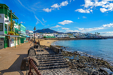 View of restaurants and shops overlooking Playa Blanca Beach, Playa Blanca, Lanzarote, Canary Islands, Spain, Atlantic, Europe