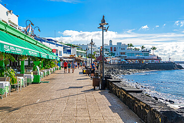 View of restaurants and shops overlooking Playa Blanca Beach, Playa Blanca, Lanzarote, Canary Islands, Spain, Atlantic, Europe