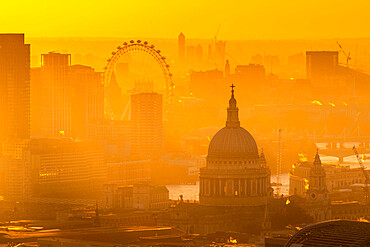 View of London Eye and St. Paul's Cathedral at golden hour from the Principal Tower, London, England, United Kingdom, Europe