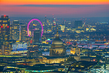 View of London Eye and St. Paul's Cathedral at dusk from the Principal Tower, London, England, United Kingdom, Europe