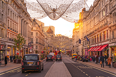 View of red buses and taxis on Regent Street at Christmas, London, England, United Kingdom, Europe