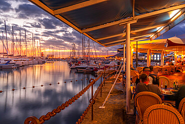 View of boats and Marina Rubicon Shopping Center from restaurant at sunset, Playa Blanca, Lanzarote, Canary Islands, Spain, Atlantic, Europe