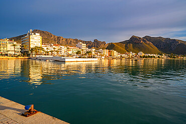 View of sunrise reflecting on hotels and bars in Port de Pollenca, Port de Pollenca, Majorca, Balearic Islands, Spain, Mediterranean, Europe