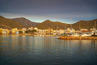 View of sunrise reflecting on hotels and bars in Port de Pollenca, Port de Pollenca, Majorca, Balearic Islands, Spain, Mediterranean, Europe