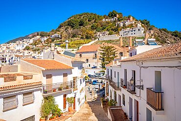 View of white washed houses and mountains in background, Frigiliana, Malaga Province, Andalucia, Spain, Europe