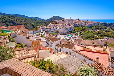 Panoramic view of white washed houses, rooftops and Mediterranean Sea, Frigiliana, Malaga Province, Andalucia, Spain, Europe