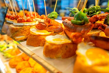 View of Tapas in food court of the Mercat des Peix, Mahón (Mao), Memorca, Balearic Islands, Spain, Europe