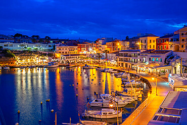 View of cafes, restaurants and boats in harbour at dusk, Cales Fonts, Es Castell, Menorca, Balearic Islands, Spain, Mediterranean, Europe